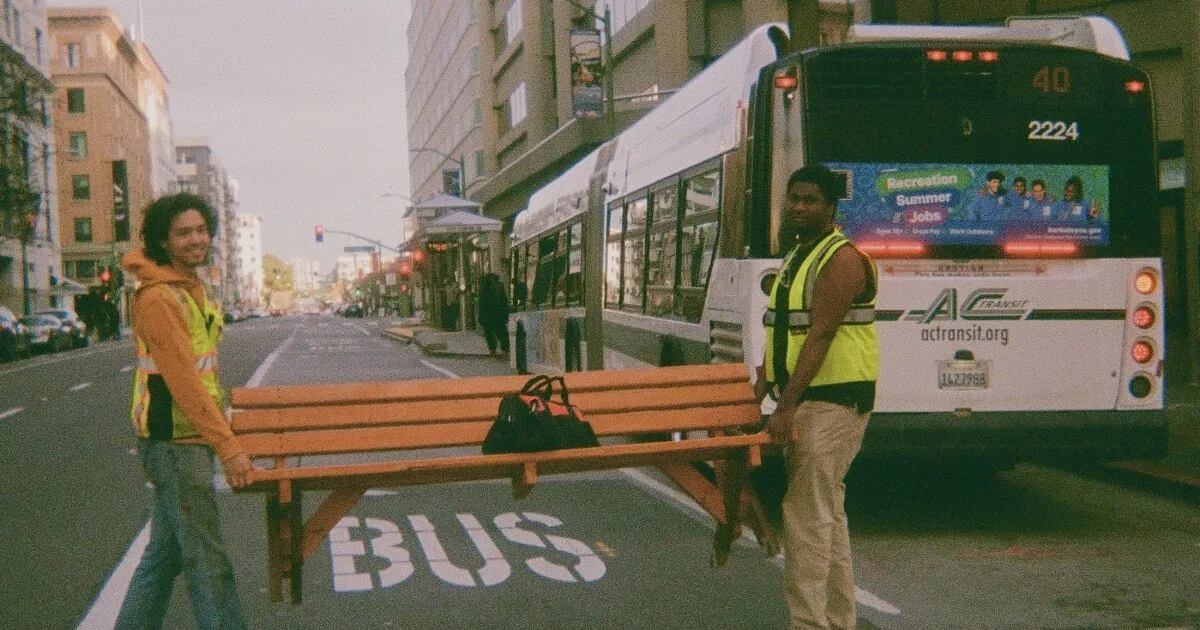 The Bench Guys / Boys / Brothers of the Bench. Darrell Owens and Mingwei Samuel in Downtown Oakland preparing to install one of their DIY guerilla bus benches. March 21, 2024.